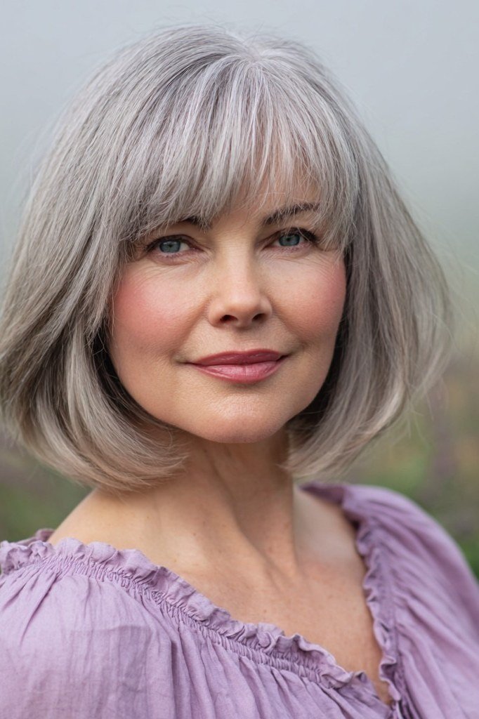 Silver Bob with Full Bangs - grey shoulder length hairstyle for women over 60