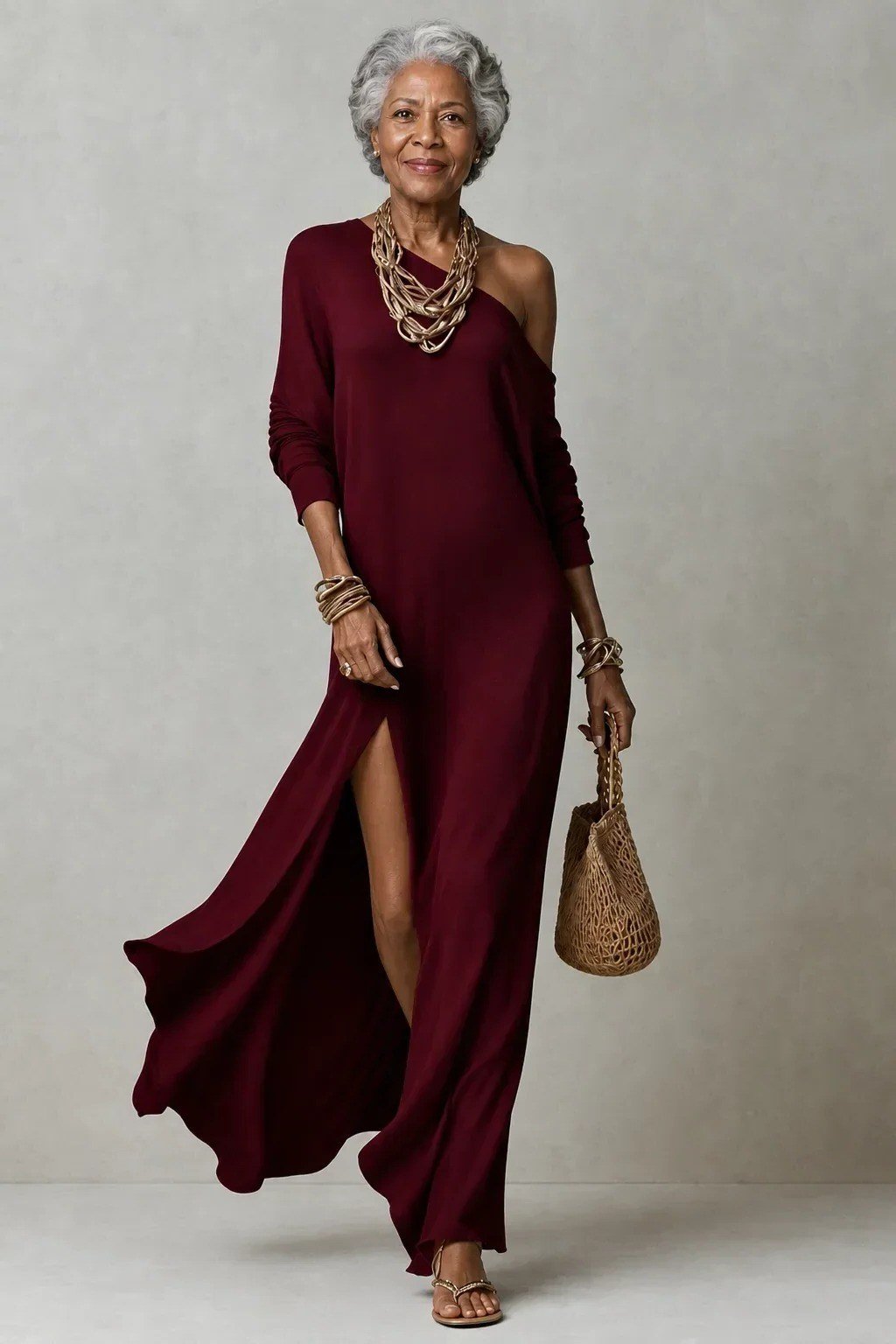 Wine-red one-shoulder asymmetric gown with gold necklace for women over 50, fall date night outfit