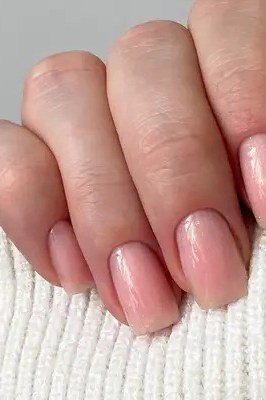Blush Pink with a White Knit Cuff - short nude nail idea for women over 50