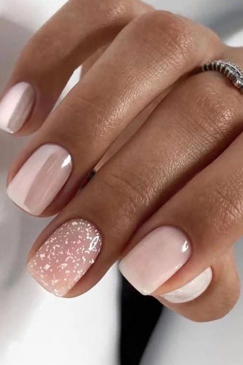 Pale pink nails with silver glitter accent nail