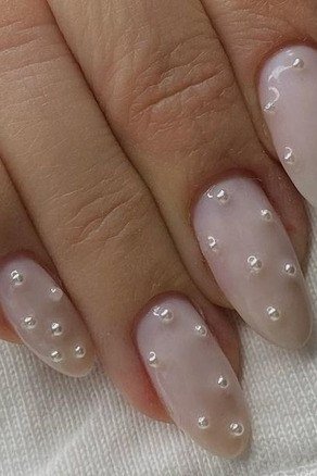 Milky Pink Short Pearl Nails - pearl finish nail idea for women over 60