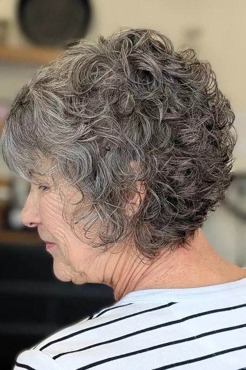 Easy gray curly lob, side view, woman over 60