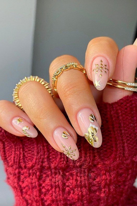 White nails with gold snowflake art, red sweater - classy Christmas nail idea for women over 70