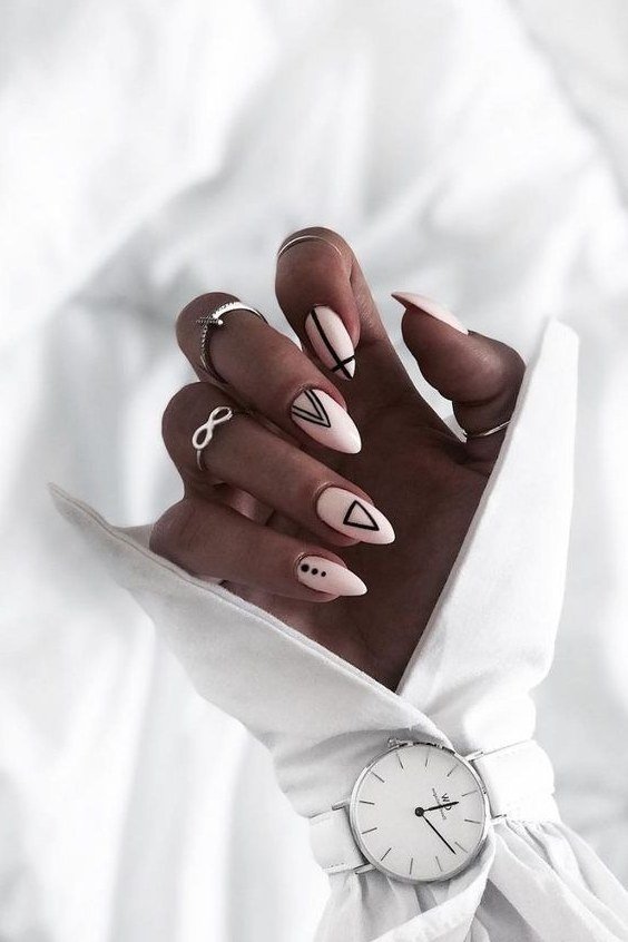 beige nail art on deep skin tone, white shirt