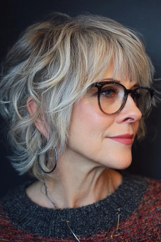 Grey shaggy haircut with glasses for women over 60