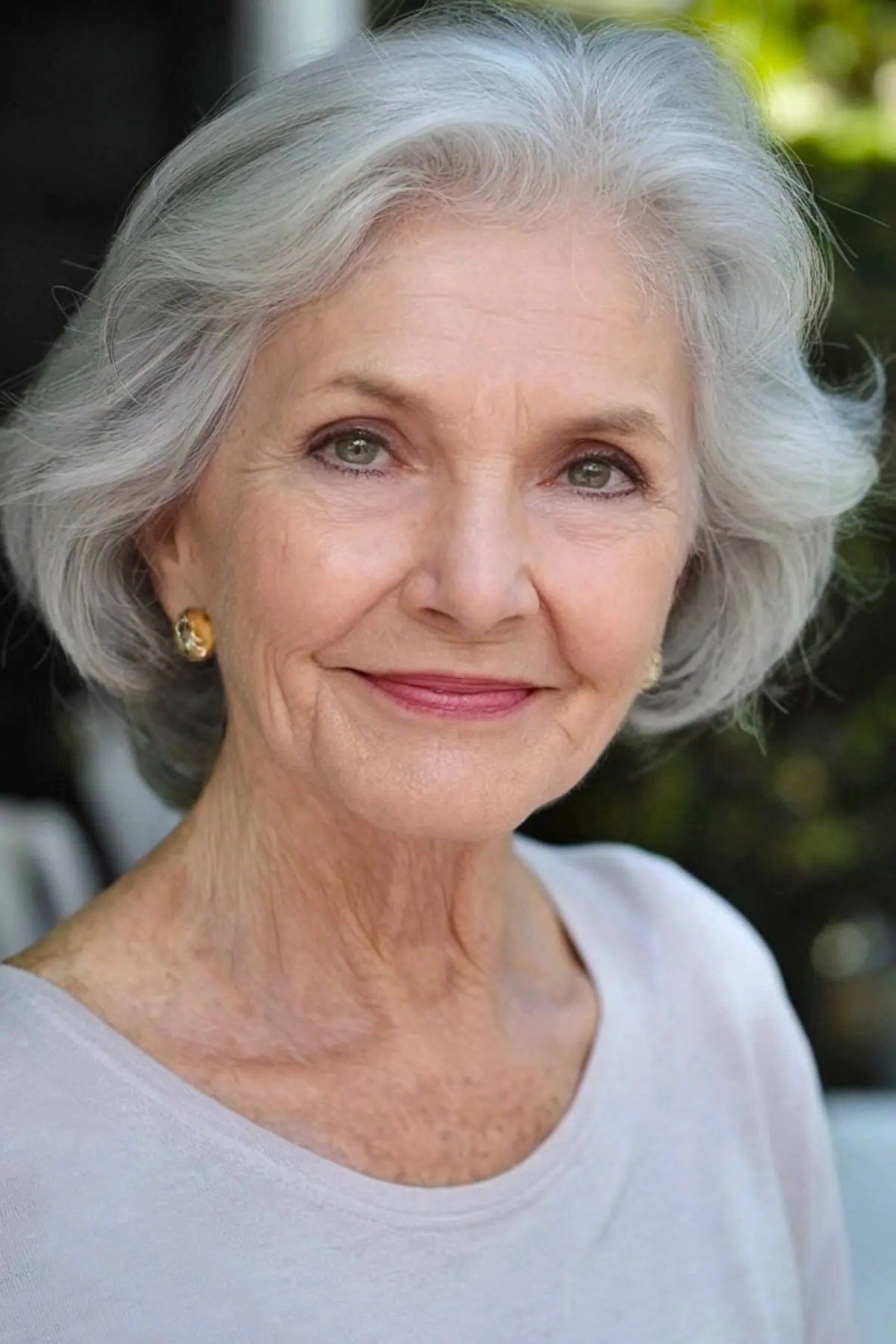 Layered grey pixie haircut with soft waves for women over 60
