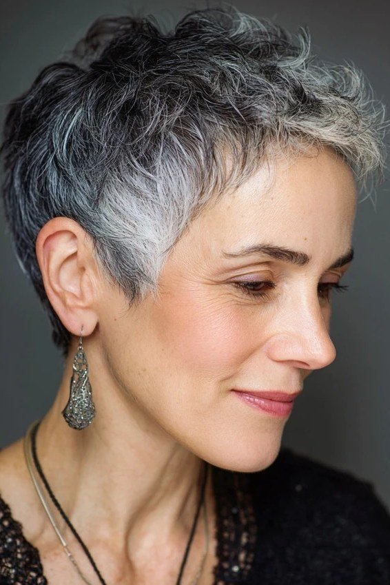 Silver feathered pixie, long face-framing layers, three-quarter view for women over 60