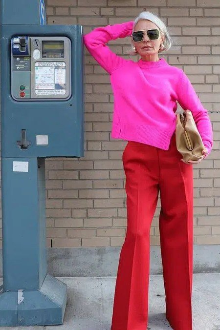 Hot pink sweater with red wide-leg trousers for women over 50