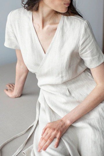 White wrap midi dress, seated, interior for women over 60