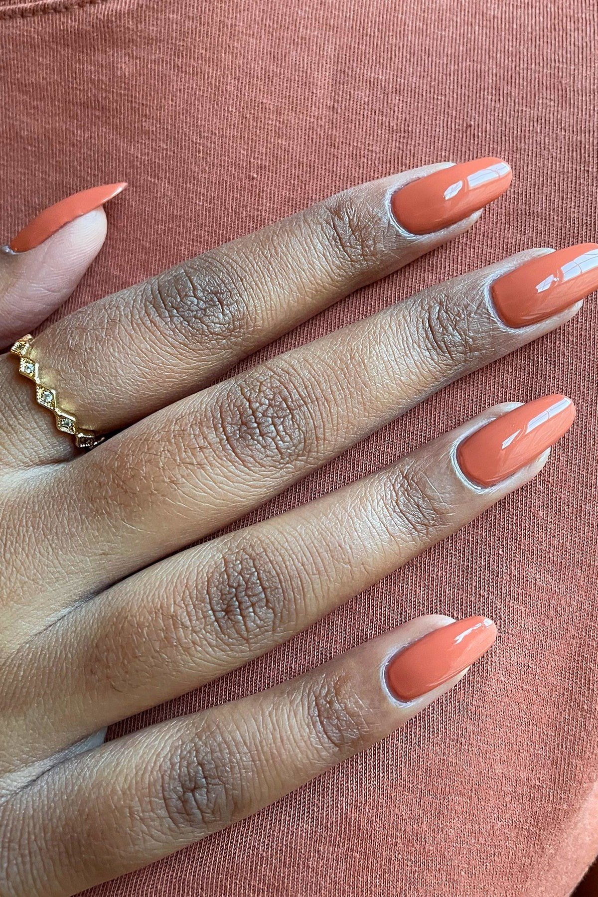Coral Peach on Deep Skin - fall nail color idea for women over 60