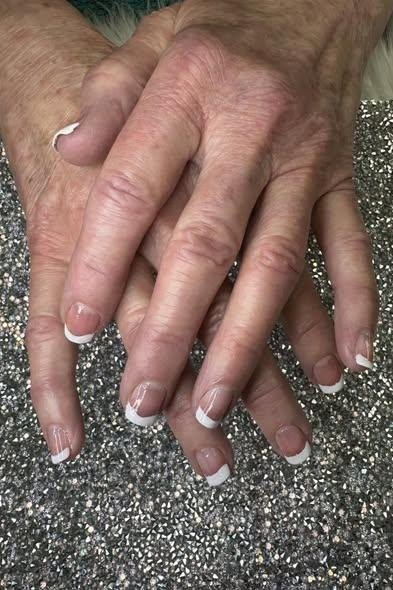 French with a Silver Glitter Backdrop - short French nails for women over 60