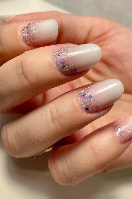 Nail art design for women over 60: nude nails with confetti glitter fade
