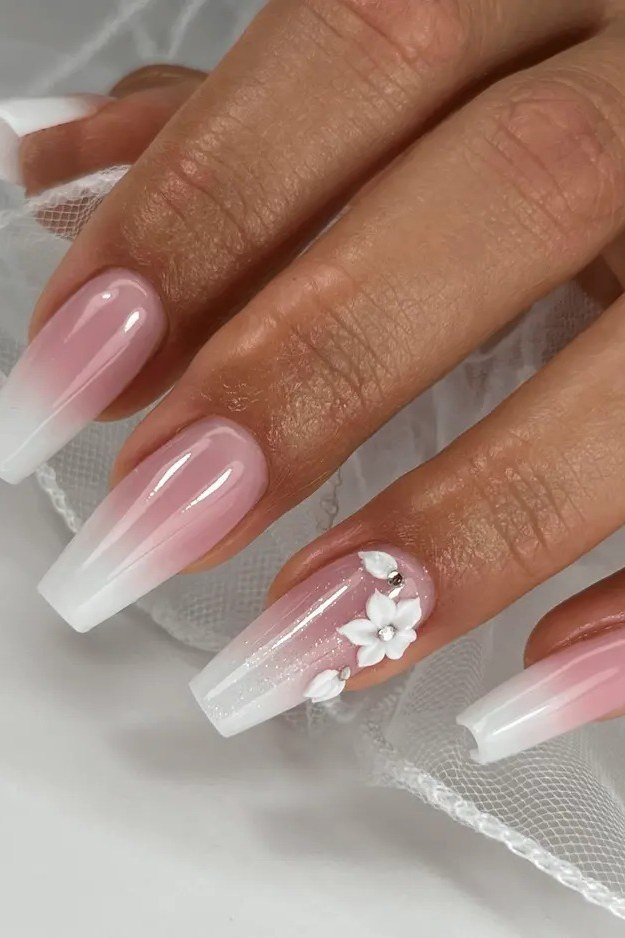 white pink baby boomer fade on long coffin nails with 3d flower