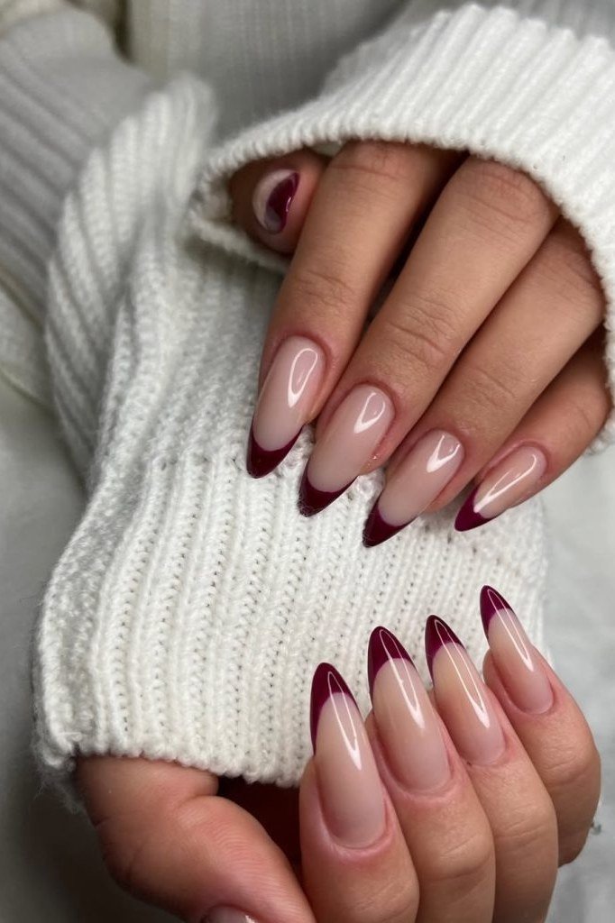 Burgundy french almond on white sweater, burgundy fall nail idea for women over 60