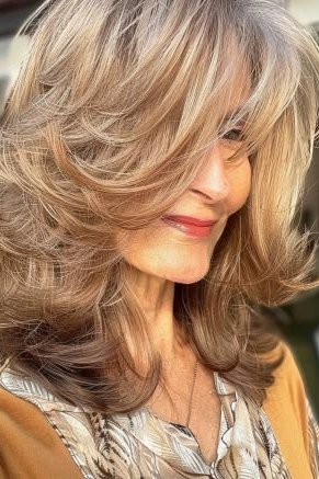 Cafe-Style Blonde Wavy Butterfly Cut - butterfly cut hairstyle for women over 60