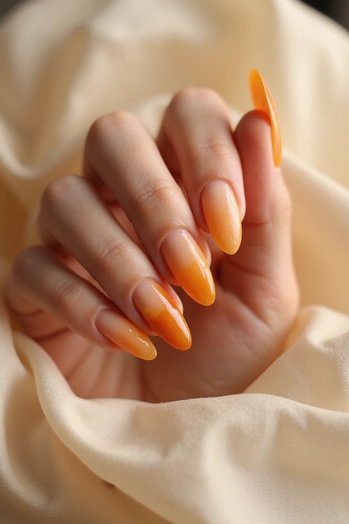 Amber Ombre on Oval Nails - Honey amber glows against cream fabric on these medium oval nails.