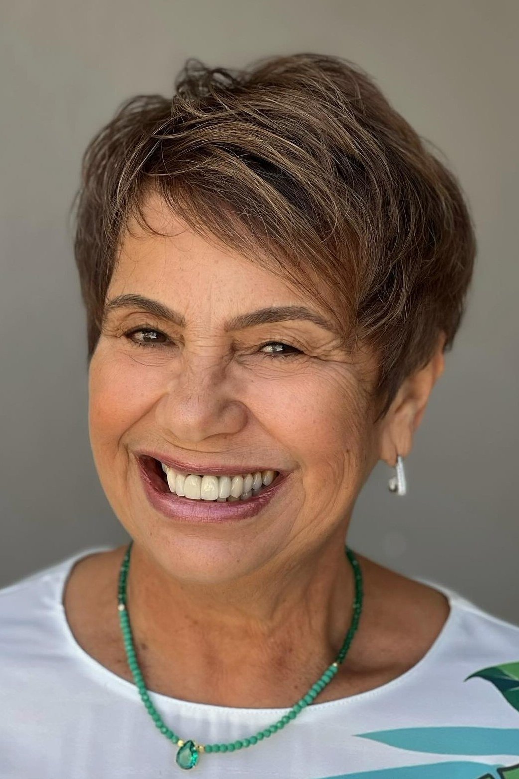 Warm brown pixie haircut for women over 50