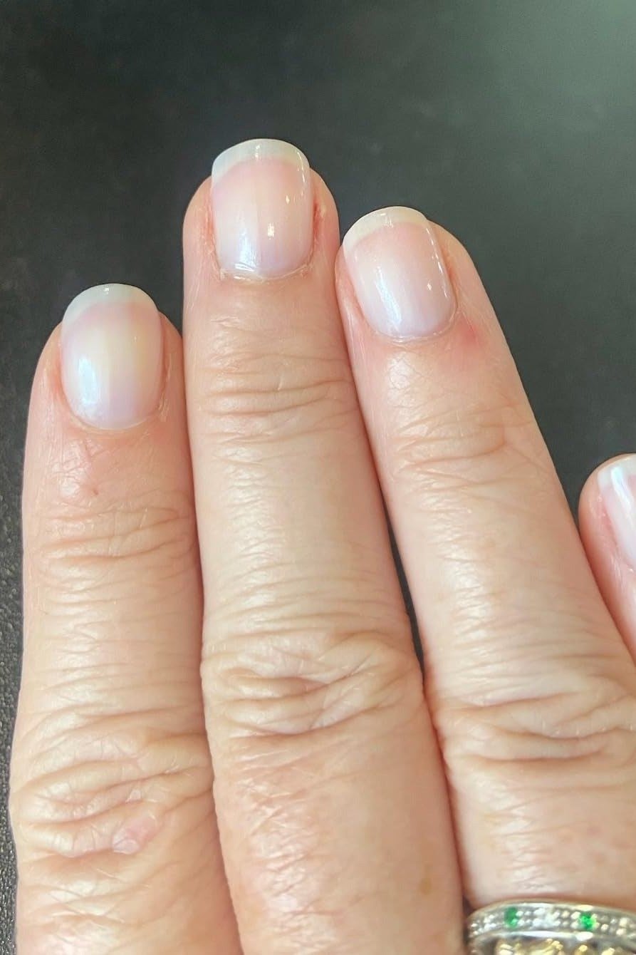 sheer white nails with a milky finish for older women