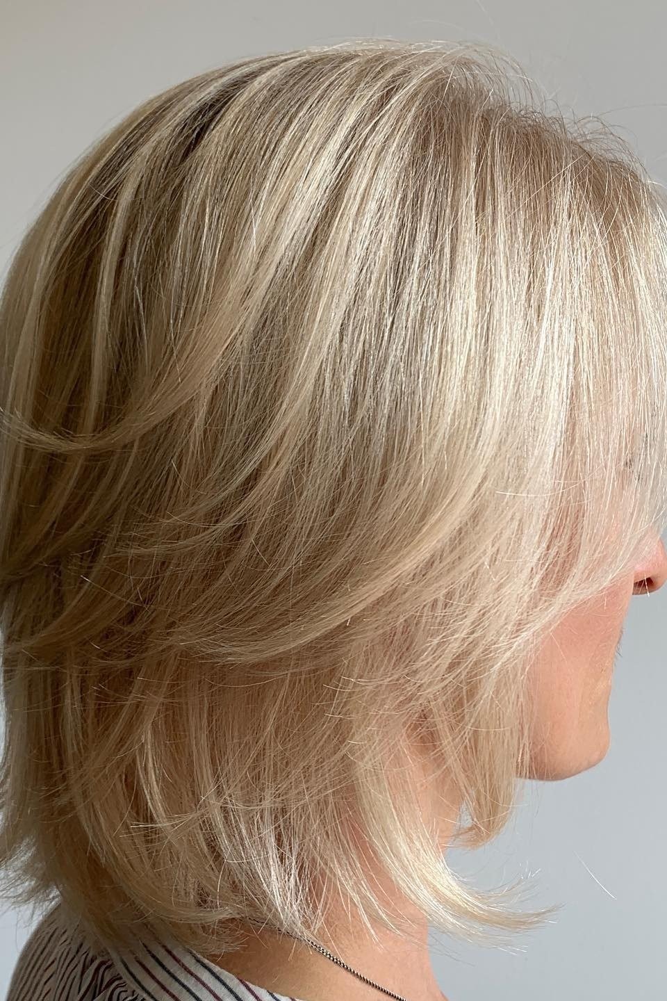 Blonde medium layered bob, side view, classic hairstyle for women over 70