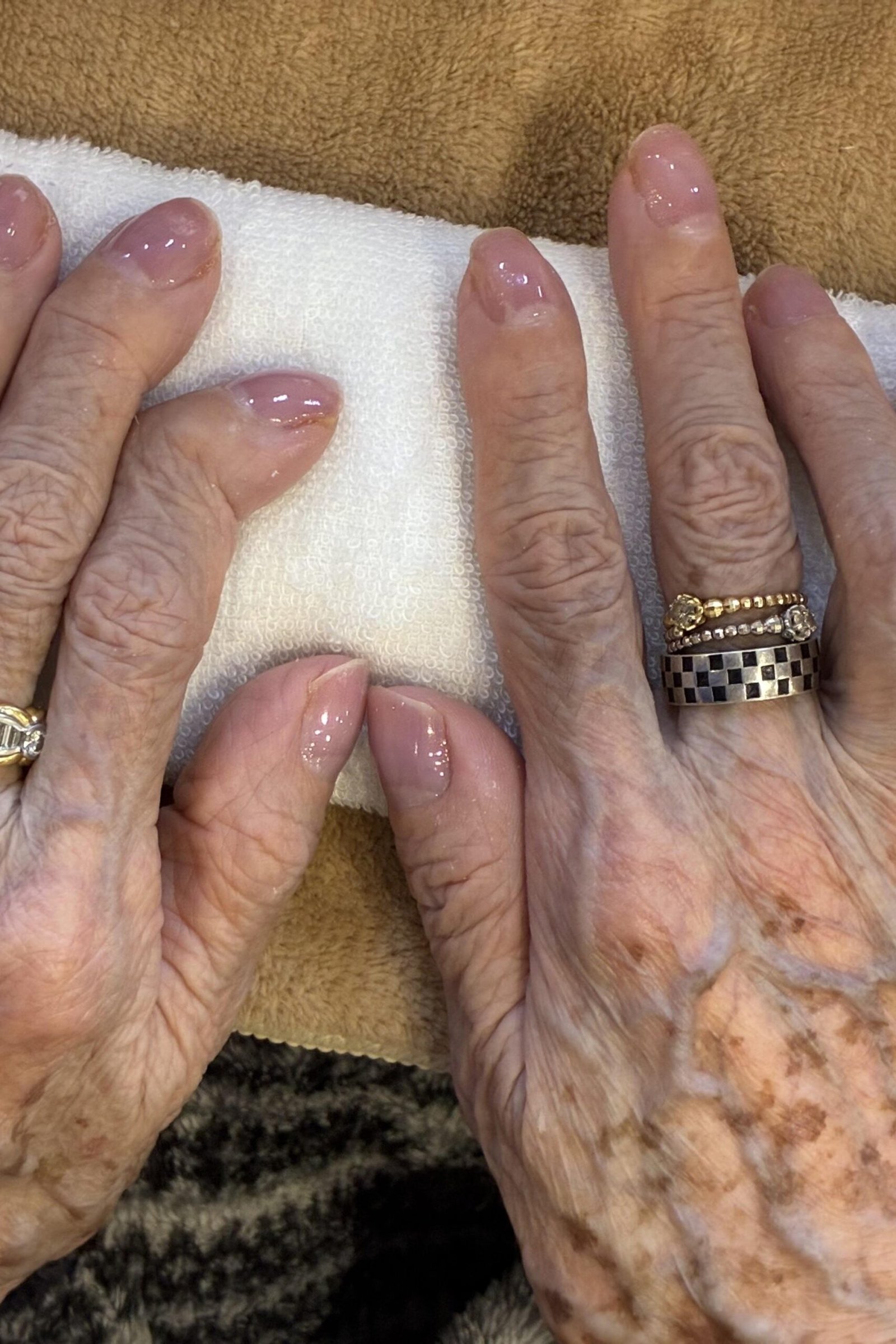 Pink french gel nails for mature hands