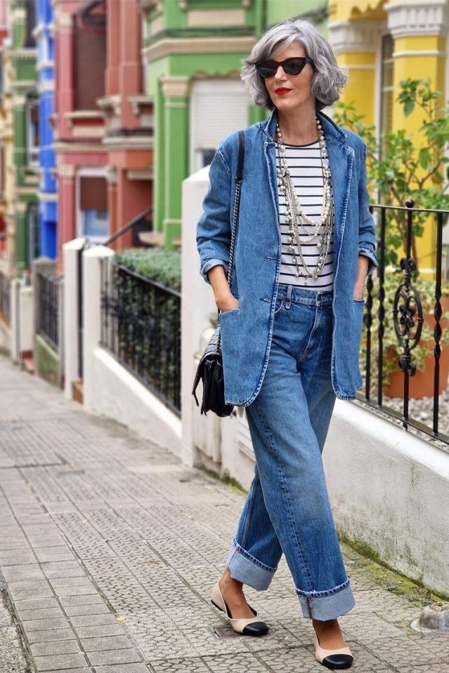 Older woman in chambray blue shirt and wide leg blue jeans