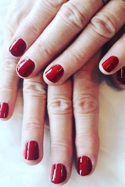 Berry mauve glossy short vibrant - flattering nail design for older women