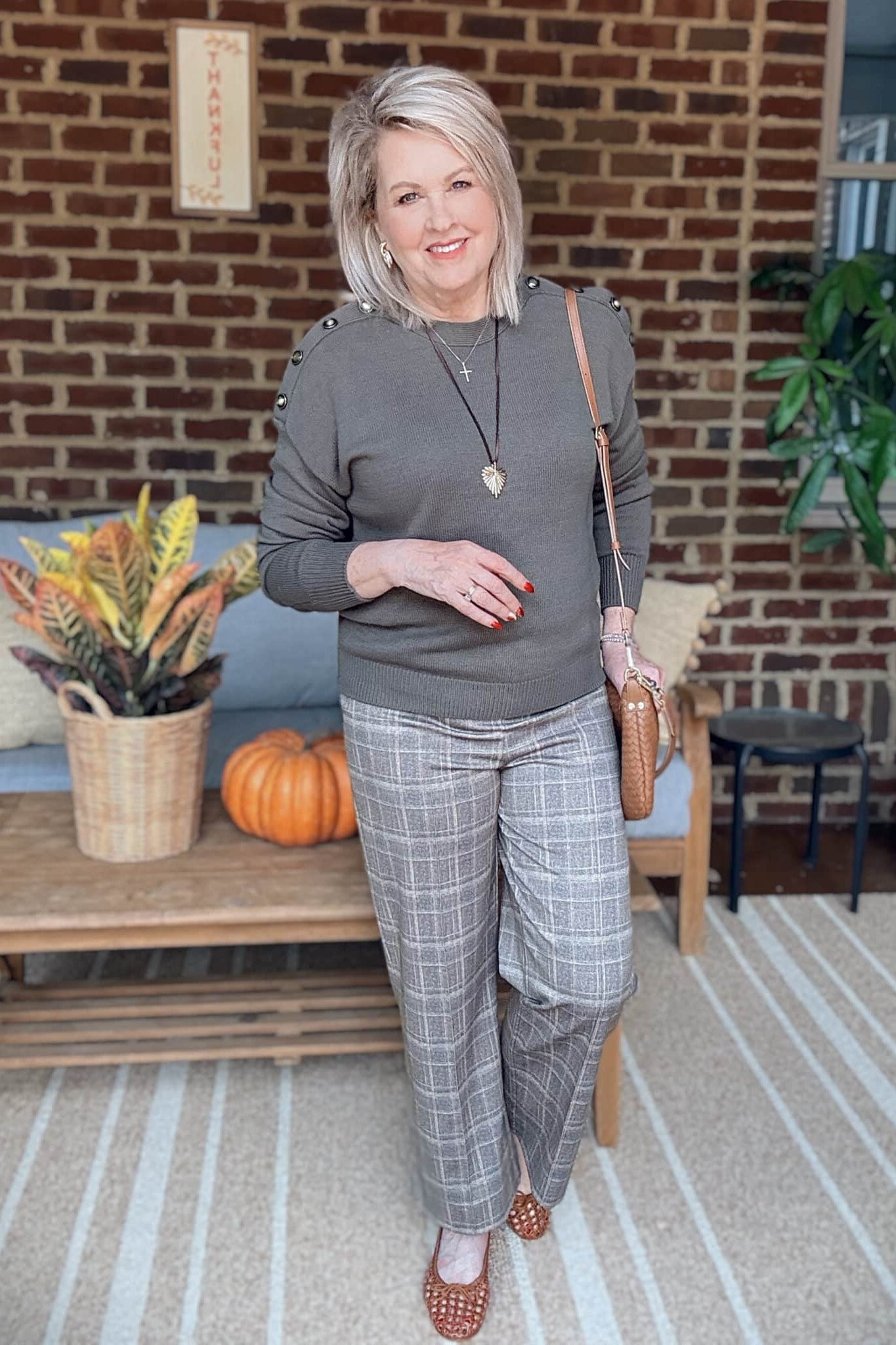 Gray Sweater with Plaid Trousers and Tan Boots on a woman over 50, fall outfit idea