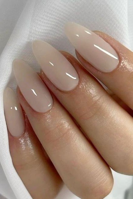 Milky nude almond nails close up for women over 50