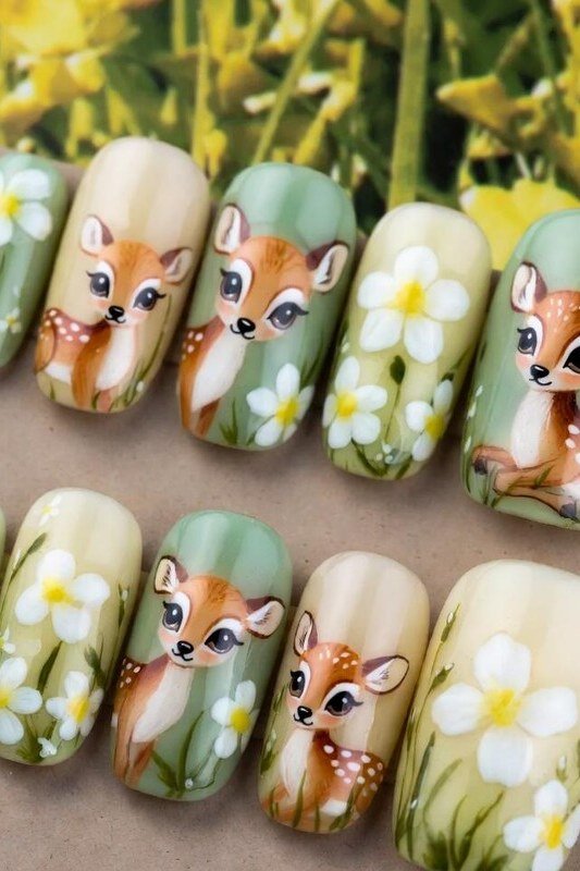 Sage green press-on nails with hand-painted fawn and daisies