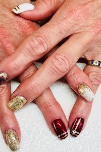 Burgundy nails with gold glitter accent nails