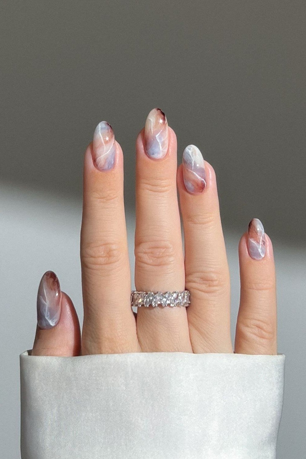 Lavender-gray and taupe marble swirl, almond shape, long length, glossy, white cuff, fall nail color for women over 40