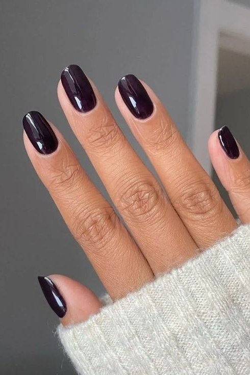 Dark plum almond nails with sweater cuff