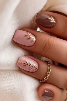 Taupe short oval gel nails with gold leaf art, elegant fall manicure