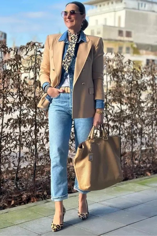 Camel blazer with patterned shirt and light jeans for women over 60