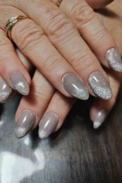 grey taupe shimmer almond gel nails with glitter gradient tips, smoky nail design