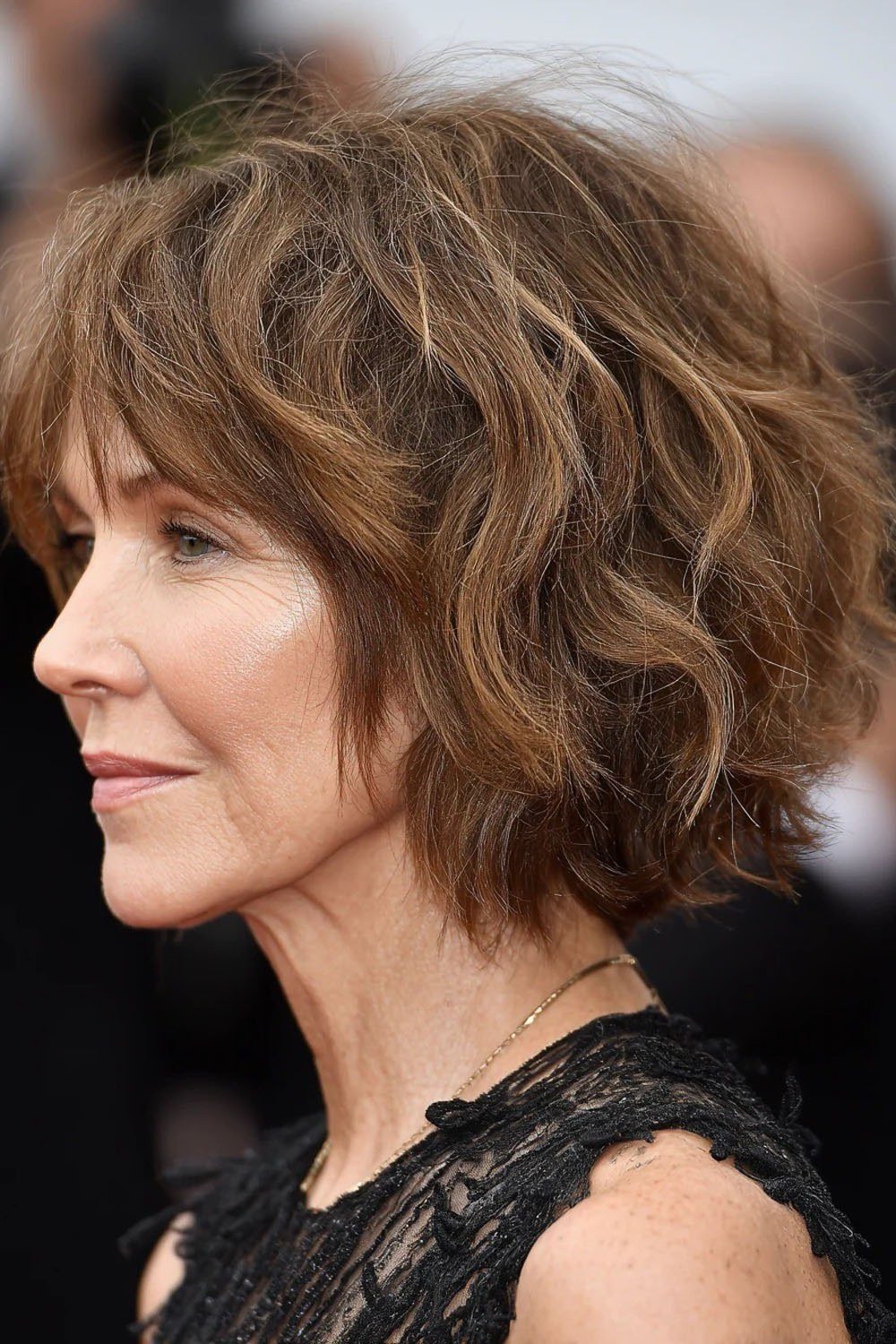 brunette wavy textured bob copper tones - textured bob haircut idea for women over 60