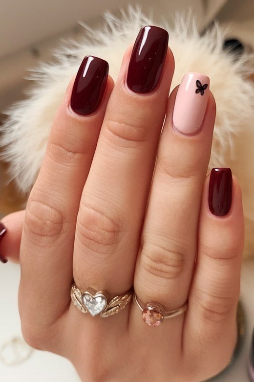 Burgundy nails with white floral art for older women