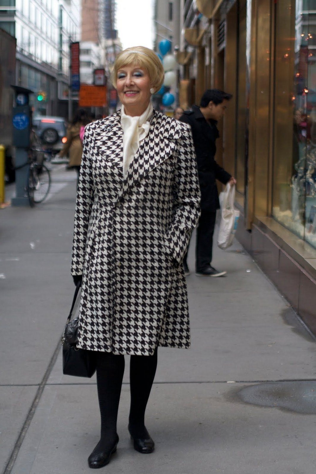 Effortlessly chic fall outfit for women over 60: black-and-white houndstooth coat