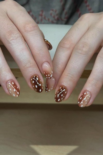 Almond nails burgundy and brown with white and gold spots fall design