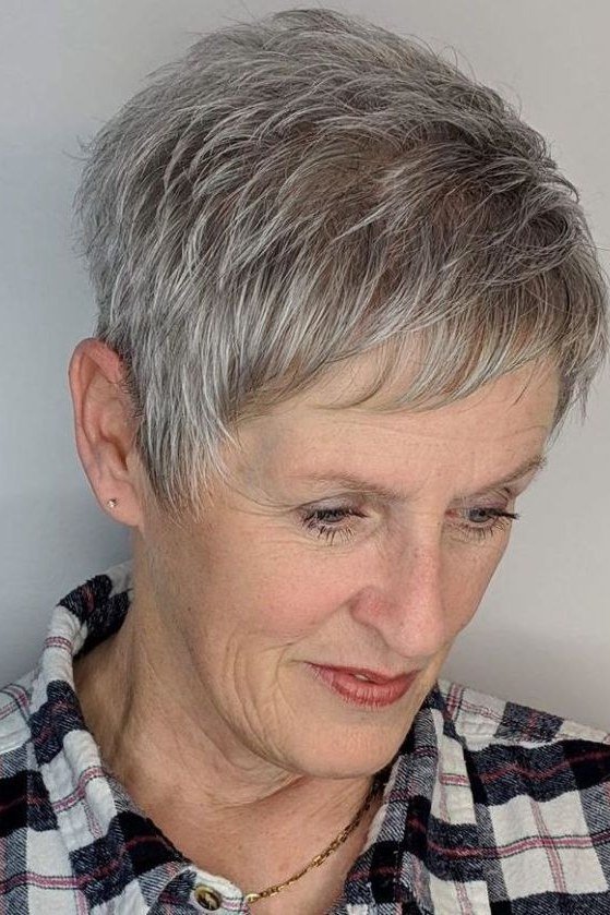 soft grey pixie with long side bangs, front view hairstyle for women over 70