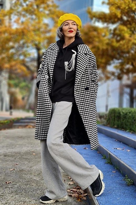 Houndstooth coat with yellow beanie fall outfit idea for women over 60