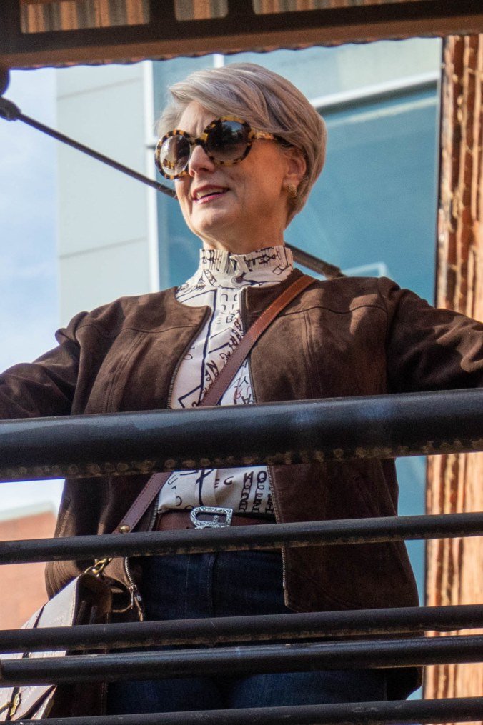 brown suede jacket at the railing fall outfit for women over 60