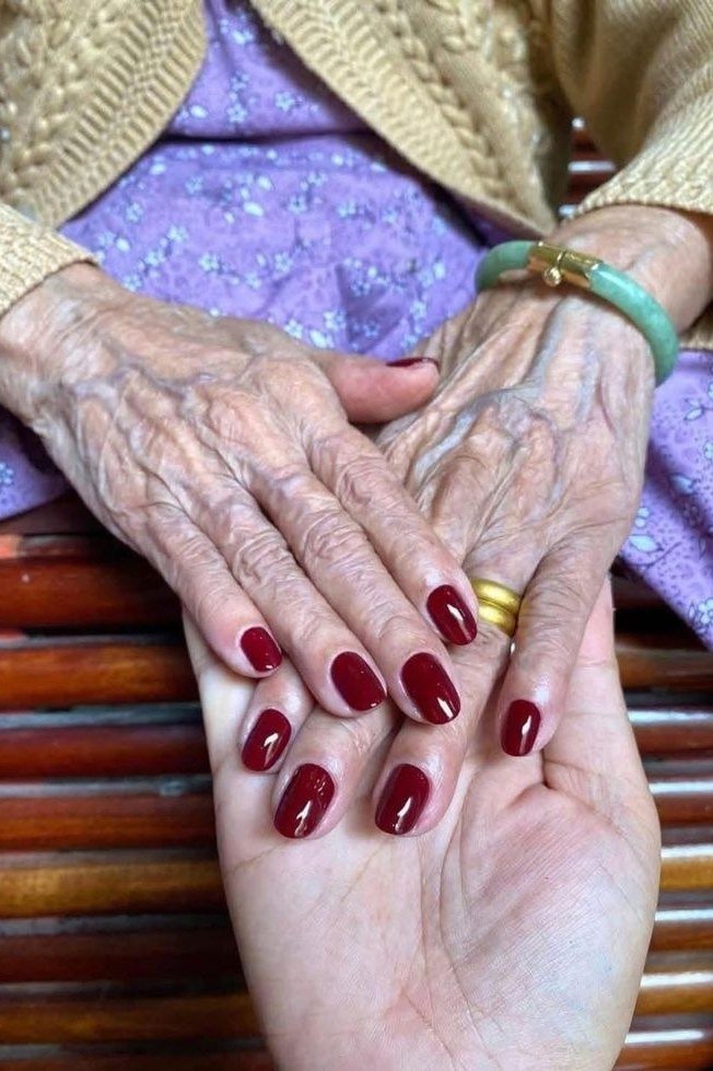 Brick Red on Very Mature Hands - fall nail color idea for women over 60