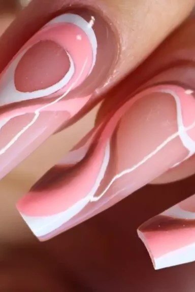 Pink white swirl marble nail art on long nails