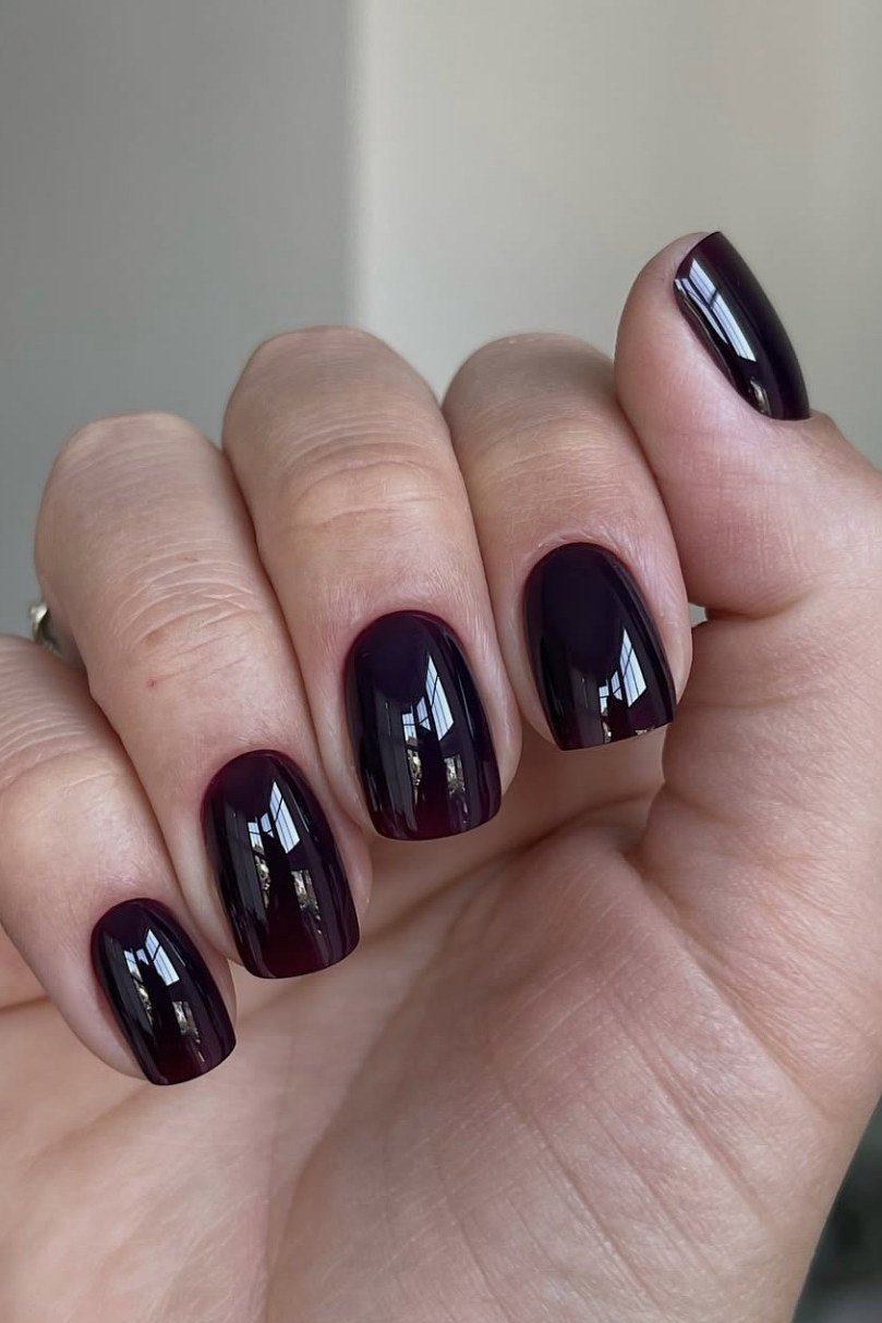 Deep Plum Black Gloss - short nail design for women over 60 that makes nails look longer