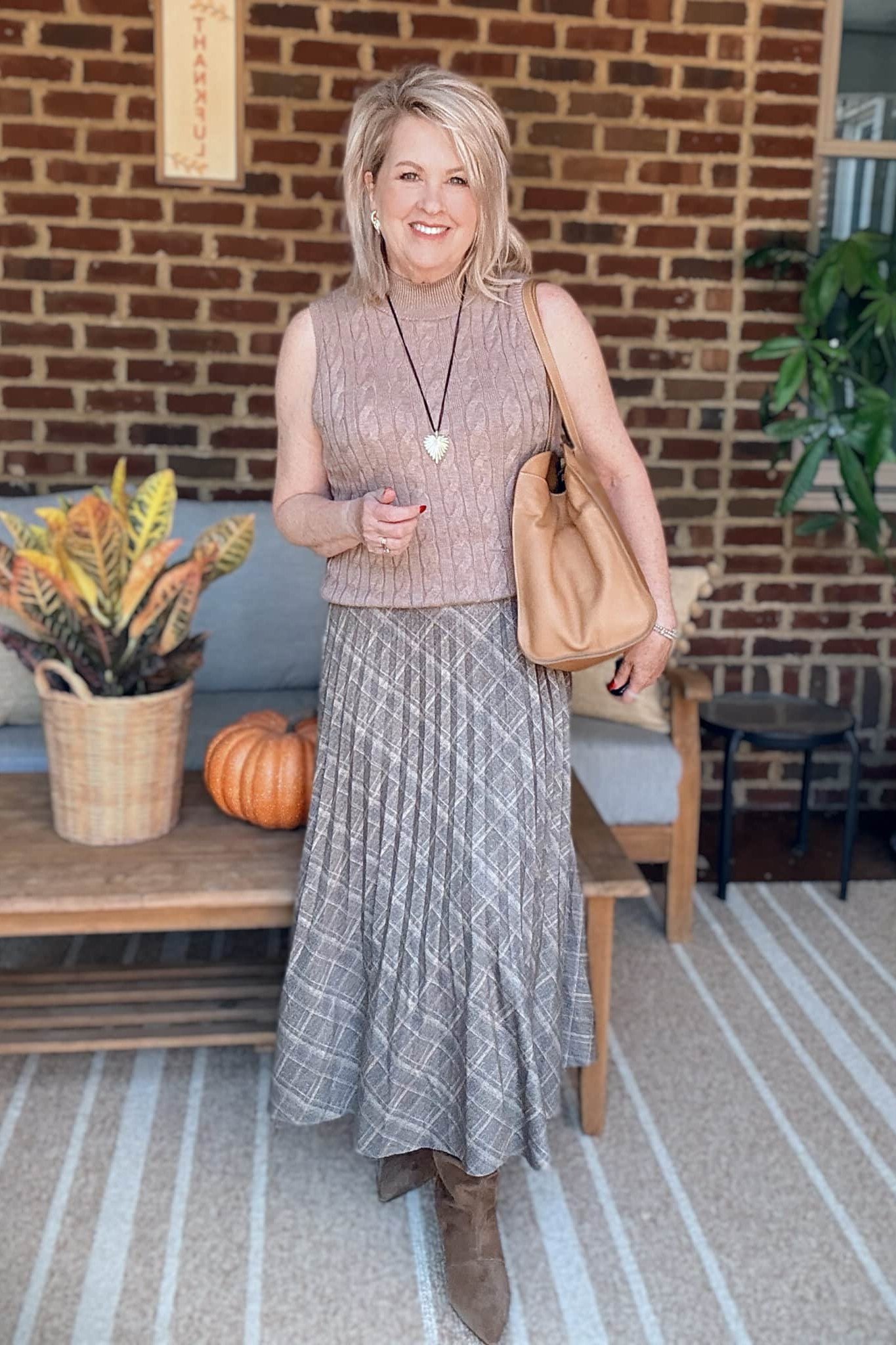 Rust-Red Sweater with Black Wide-Leg Trousers on a woman over 50, fall outfit idea