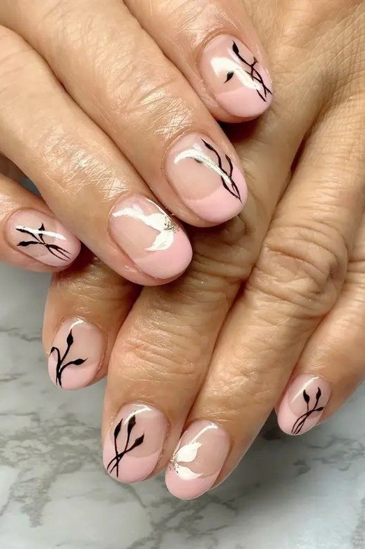 Blush nails with botanical line art for women over 60
