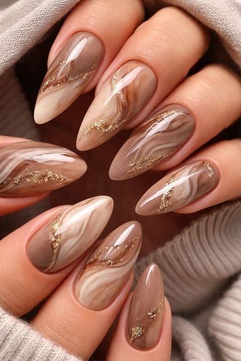 taupe marble swirl nails with gold accents