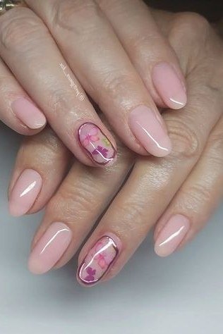 pink nails with pretty pink marble accents for older women