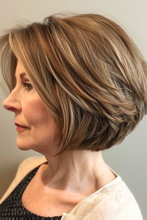 Brunette layered bob, side view, short layered bob hairstyle for women over 60